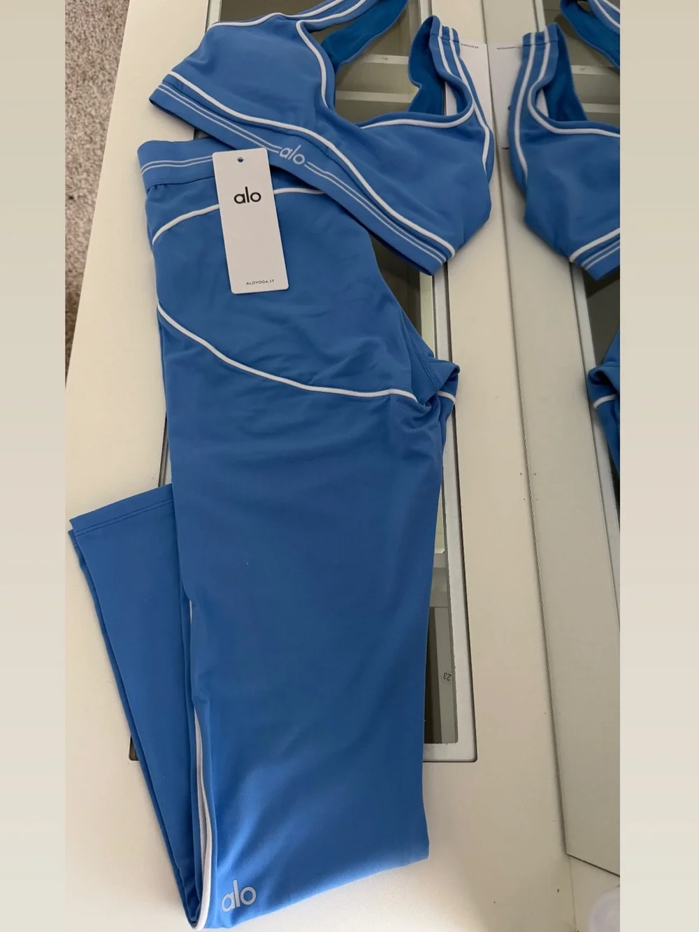 ALO Yoga Blue Sports Bra with White Piping